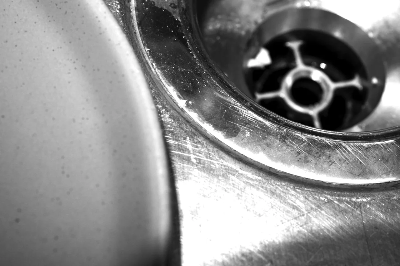 Close-up of a stainless steel sink drain